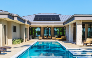 Solar pool system installed on roof with pool and backyard showing