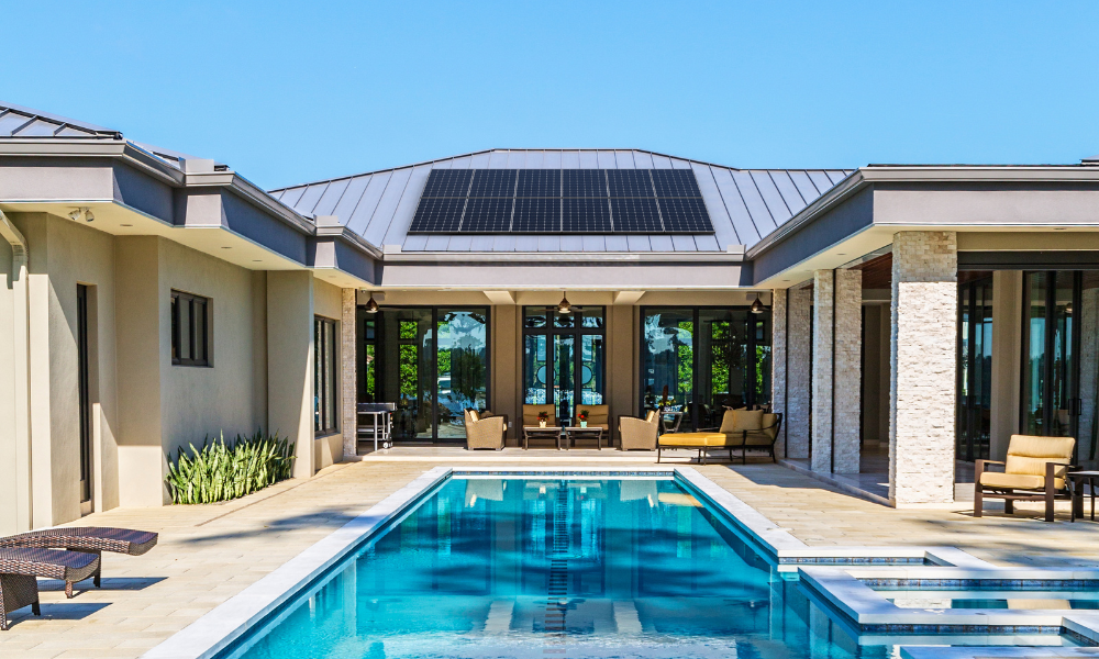Solar pool system installed on roof with pool and backyard showing