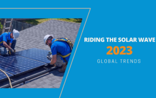 Riding the solar wave 2023 global trends. Two workers installing solar panels on top of roof.