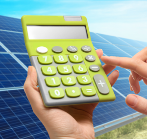 A free energy analysis with a customized quote. Photo of someone doing the calculations on a green calculator with a solar array in the background.