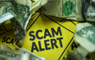 Scam alert sign surrounded by money, highlighting Evergreen Solar Solutions' tips for avoiding solar scams and finding reputable dealers.