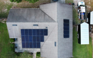 Aerial view of a residential solar panel installation by Evergreen Solar Solutions, highlighting efficient use of rooftop space for sustainable energy generation.